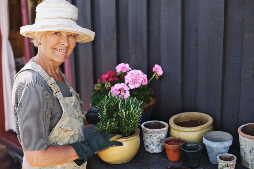 In-home care provides aging seniors the support and care to stay active like gardening.
